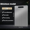 A silver stainless steel miniature cutting board with upgrade features shown against a dark background.