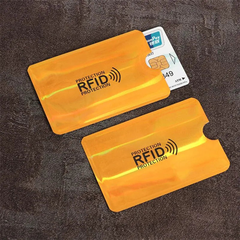 Two yellow RFID protection cards are shown against a dark background with a payment card nearby.