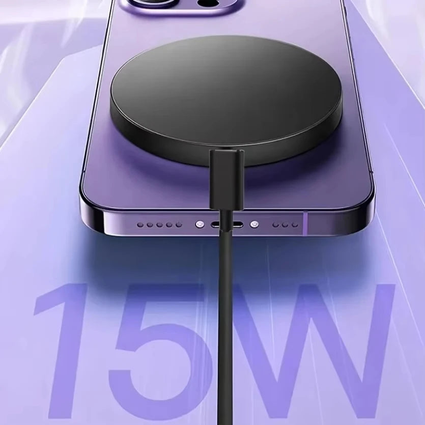 A purple iPhone is shown with a black magnetic wireless charging pad connected by a cable, demonstrating 15W charging.