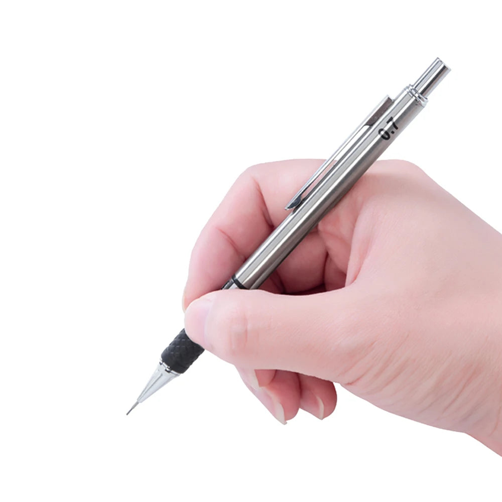 A hand holds a silver metal mechanical pencil set with precision leads.