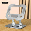 A silver 360° rotatable tablet stand with an adjustable foldable design resting on a wooden surface.
