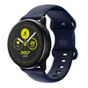 A dark blue silicone smartwatch displaying a fitness tracking screen with step count and date.