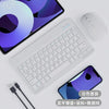 A white 10-inch Bluetooth keyboard and mouse combo with a smartphone shown in a studio setting.