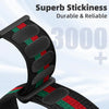 Close-up of a black hook and loop watch strap with red and green accents, showing its durability.