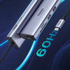 محور USB-C فضي مزود بمنافذ HDMI و Ethernet وتوصيل طاقة لأداء 4K@60Hz.