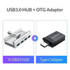 A white multi-port USB 3.0 hub with a clip and a black Type-C adapter.