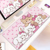 Pink cartoon illustration desk mat featuring cute white rabbits with pink bows