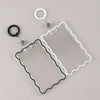 Clear acrylic card holder with a black wire frame and attached to a key ring.