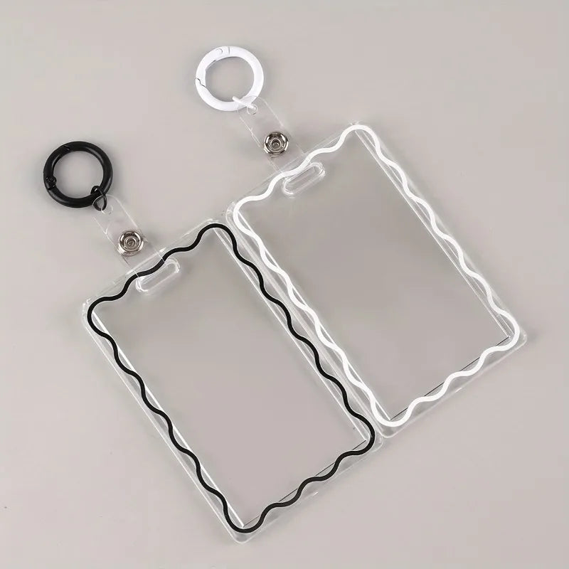 Clear acrylic card holder with a black wire frame and attached to a key ring.