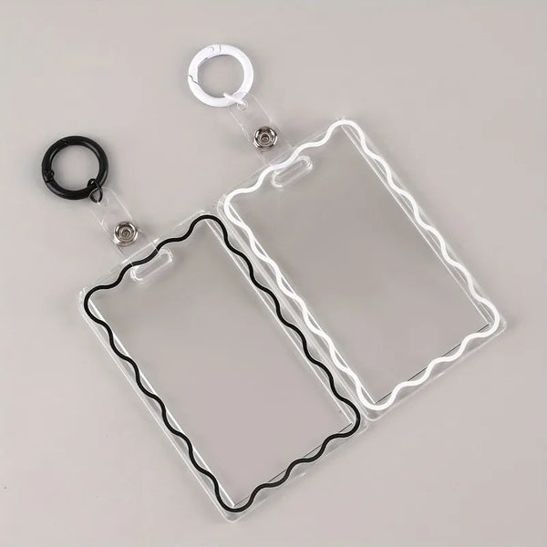 Clear acrylic card holder with a black wire frame and attached to a key ring.