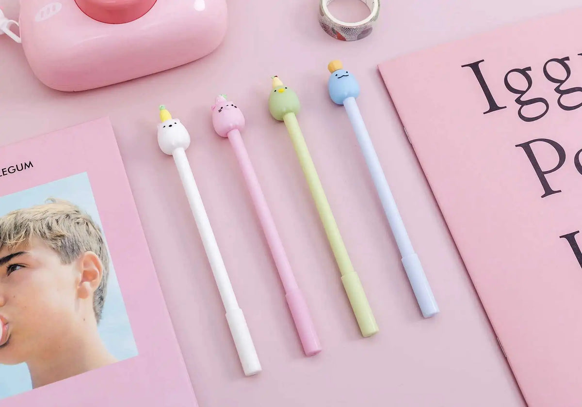 A collection of cute cartoon fruit gel pens in various pastel colors, including pink, yellow, green, and blue.
