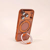 A magnetic phone case with a stand for an iPhone in a warm orange color.