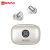 A silver wireless earphone case and a white Bluetooth earphone with a microphone.