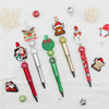 A set of decorative beaded ballpoint pens featuring Christmas and festive designs.