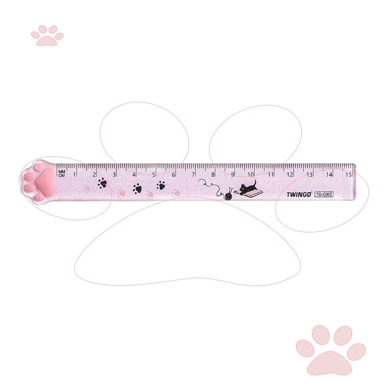 Pink plastic ruler marked in centimeters with a cat paw design.
