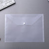 A clear plastic document pouch with a sealed flap and a small white button is shown on a gray surface.