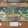 A large desk mat featuring a cute green frog and tropical plants for a gaming mousepad.