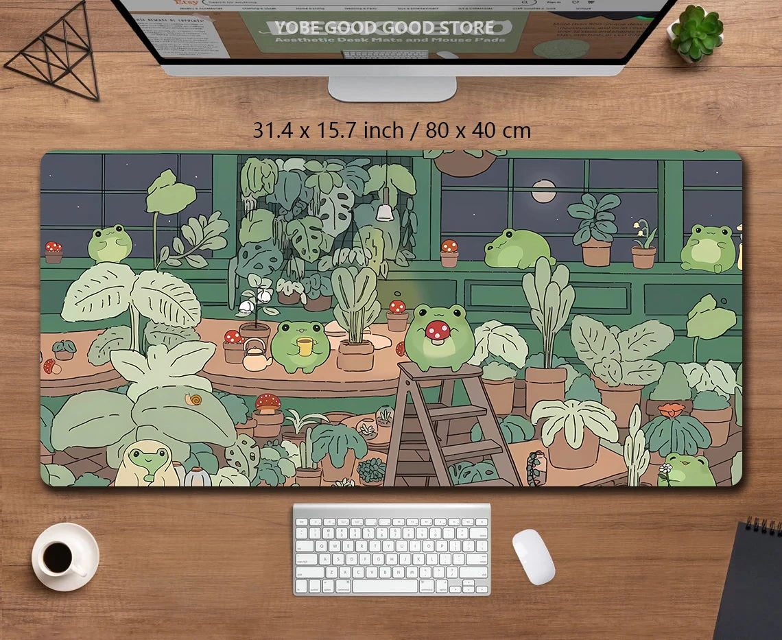 A large desk mat featuring a cute green frog and tropical plants for a gaming mousepad.