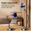 A black multi-angle adjustable phone holder stand with a silver phone mounted on an arm, shown in a home setting.