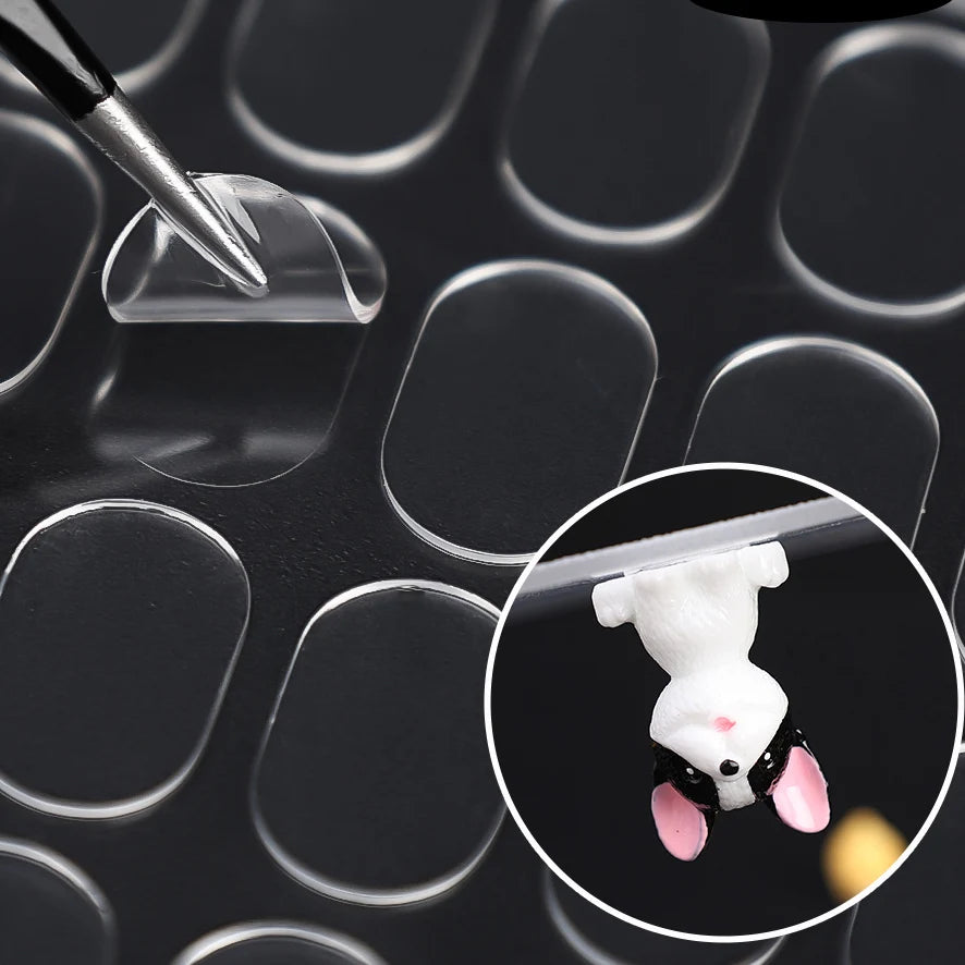 Close-up of a white mouse placed on a clear adhesive pad for fixing or testing purposes.