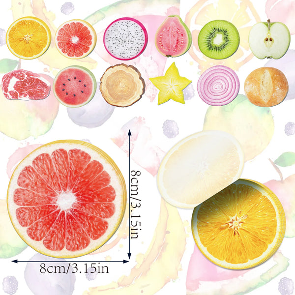 A collection of various sliced fruits like citrus, watermelon, kiwi, and apple used as fruit-shaped sticky notes.
