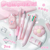 A set of pink and white cartoon school stationery items including pens and accessories displayed on a white surface.