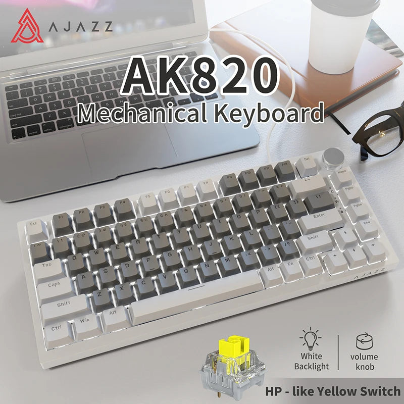 A white mechanical keyboard is shown next to a laptop, highlighting its layout and yellow switch.