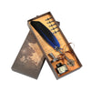 A set of retro calligraphy feather dip pens displayed in a wooden gift box with various nibs and accessories.