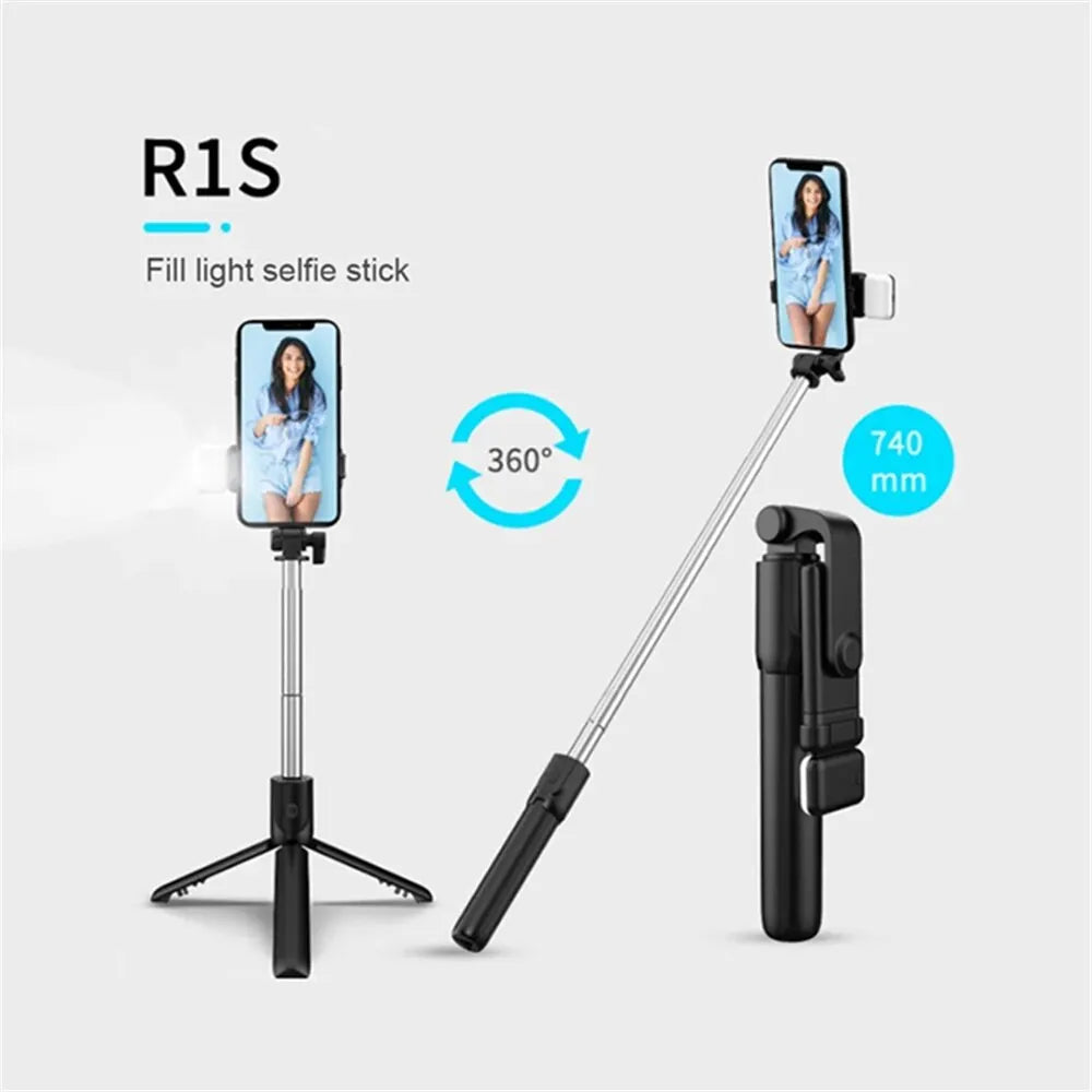 A black extendable Bluetooth selfie stick with a fill light and a smartphone attached, shown against a white background.