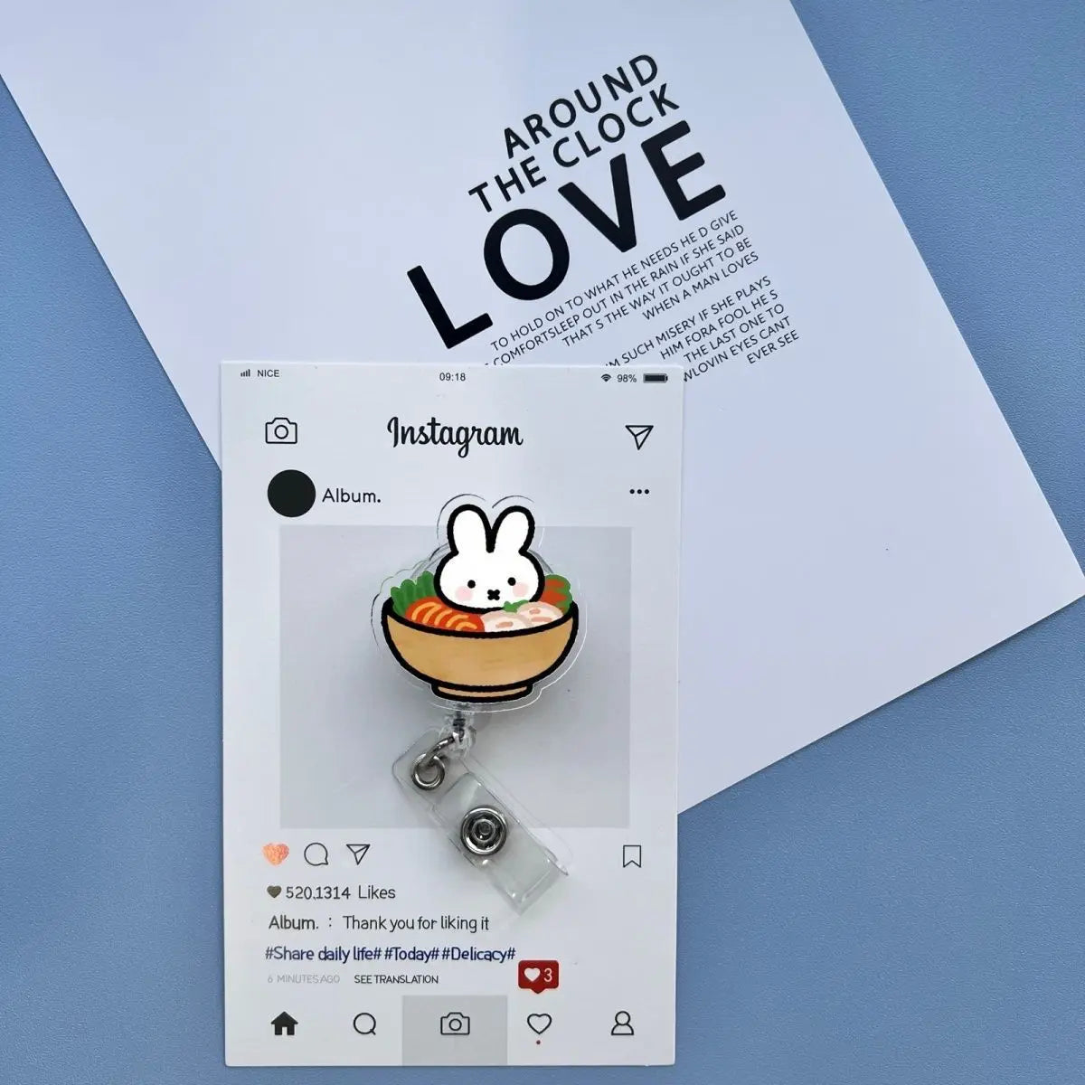 A white Instagram post featuring a Miffy rabbit charm on a badge reel against a light blue background.