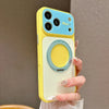 A yellow phone case with a blue camera lens and a circular ring stand attachment is held by a person.