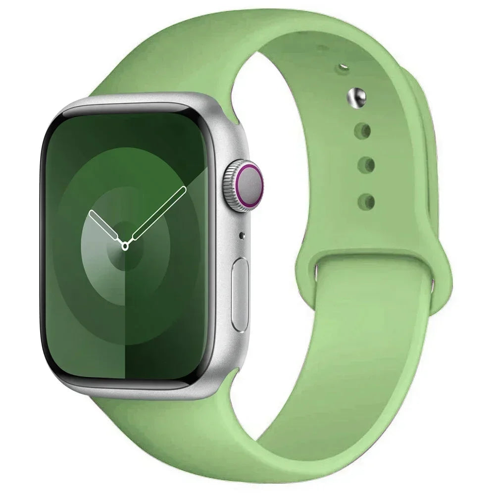 A green silicone sport band for an Apple Watch shown on a white background.