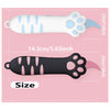 A white cat paw shaped mini box cutter with light blue accents and a black cat paw shaped utility knife.