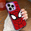 A close-up of an iPhone case featuring a red and black Spider-Man mask design with a clear back, held by a hand.