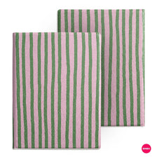 A close-up of a pink and green striped folio cover for an e-reader.
