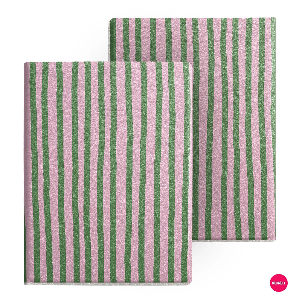 A close-up of a pink and green striped folio cover for an e-reader.