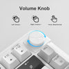 Primer plano de un teclado de membrana RGB compacto mostrando el mecanismo del dial de volumen y la disposición de las teclas