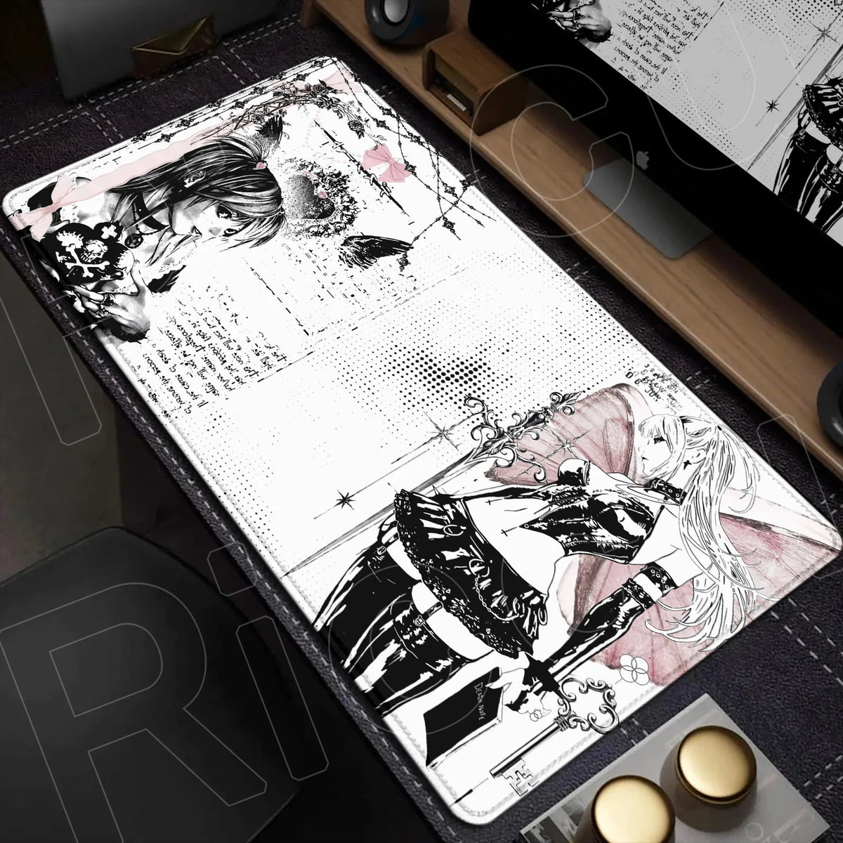 A large mouse pad featuring a black and white illustration of a character with long hair and a sword on a dark surface.