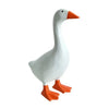 A white resin duck figurine with an orange beak and feet, used as a magnetic desk organizer.
