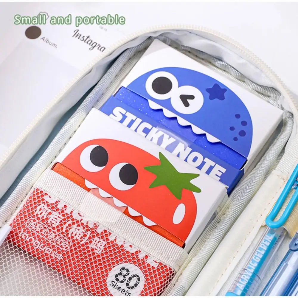 A pack of cartoon fruit pearlescent pull-out sticky notes in blue and orange inside a clear plastic sleeve.