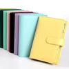 A set of colorful A6 PU leather budget binders with cash envelopes lined up.