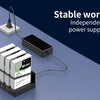 A black external hard drive docking station with four drives is shown connected to a power supply.