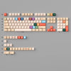 A collection of retro AI illustrator PBT keycaps in cherry profile featuring various colors and layouts.