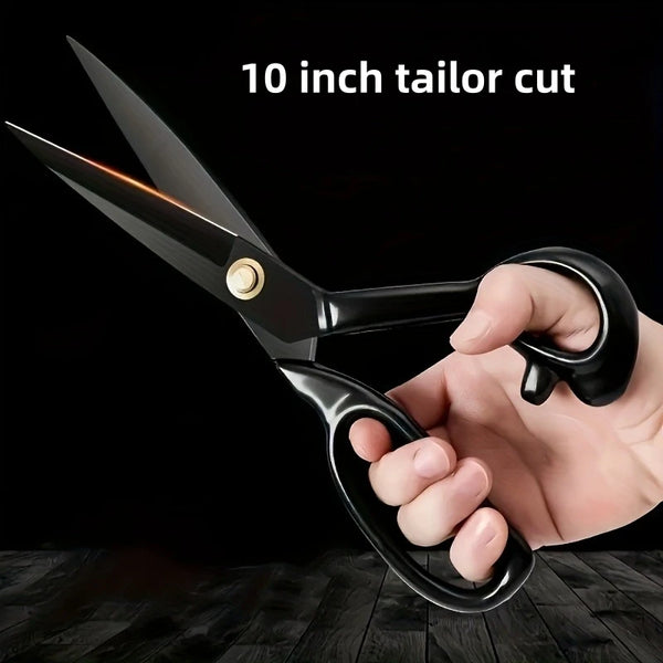 A hand is holding a black tailor cut scissor with a 10 inch blade, demonstrating the tool.