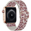 A close-up of an Apple Watch with a rose gold case and a leopard print nylon band.