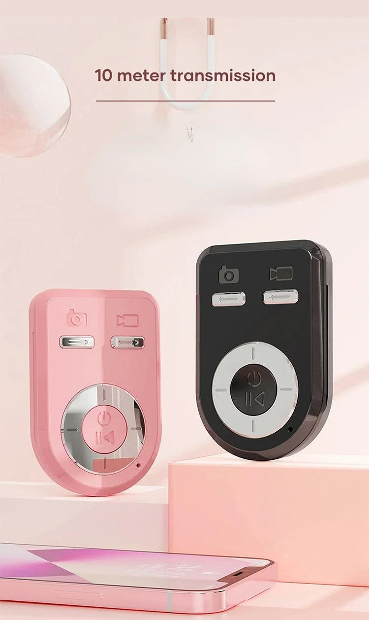A pink 360° rotating selfie stick with a Bluetooth remote and LED light is displayed against a light pink background.