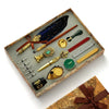 A luxury fountain pen set with a wax seal kit displayed in a wooden box, featuring various pens and seals.