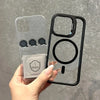 A clear magnetic shockproof phone case for an iPhone is held in a hand against a gray background.