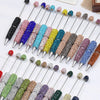 A collection of 20 rhinestone beaded pen accessories in various colors and finishes displayed on a white background.