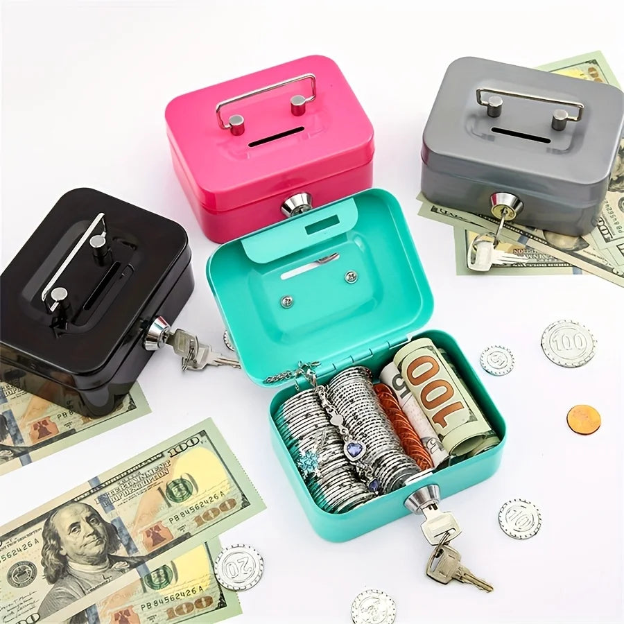 A collection of pink and gray steel cash boxes with key locks and a green box containing stacked coins and bills.
